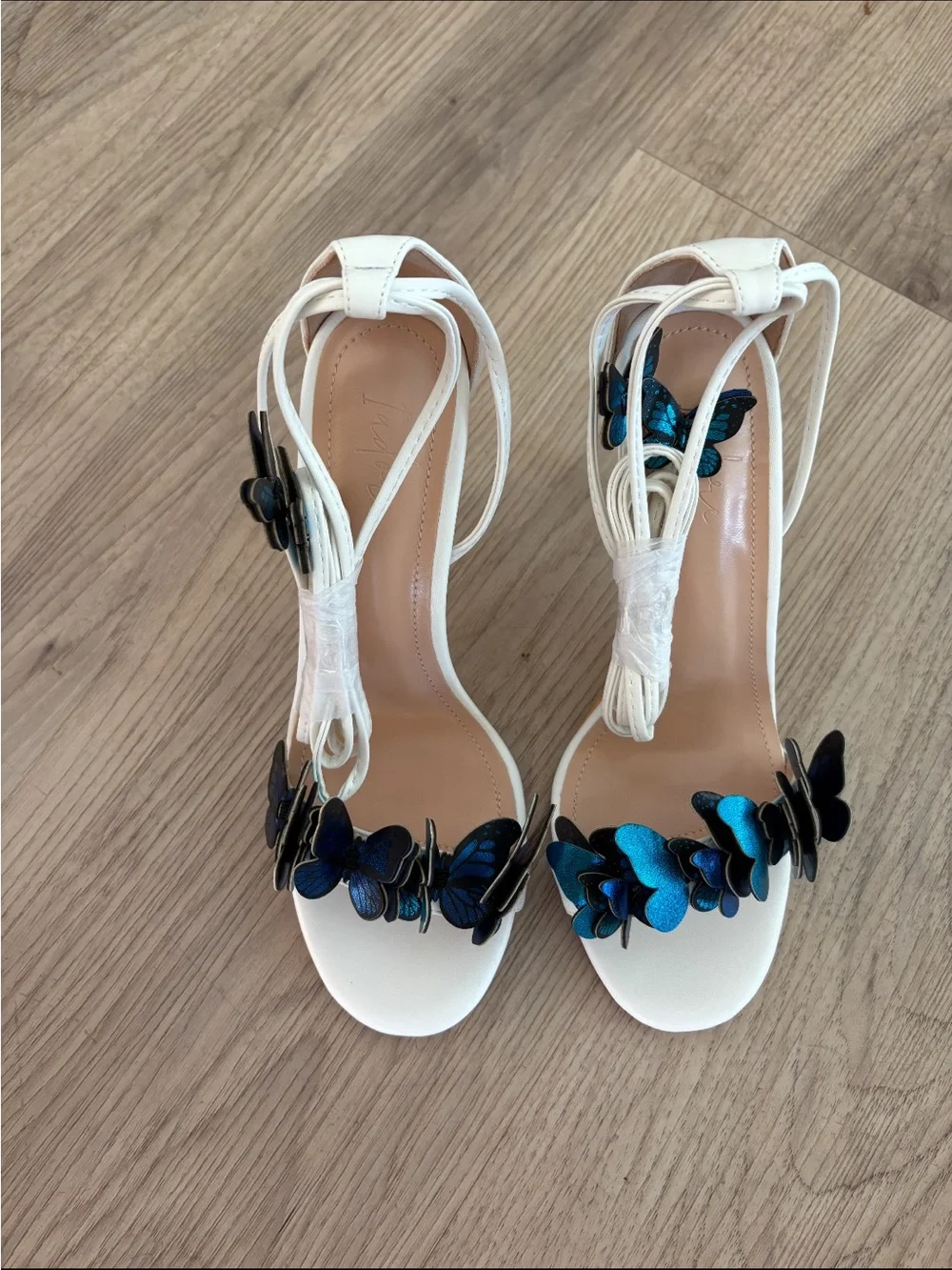 I adore White Ankle-Tie Heels with Blue and Black Butterfly Accents laceup